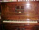 Player piano roll mechanism