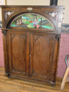 Seeburg K #61,954, made in 1915 with flute pipes and three dancing girls motif art glass; Wells Fargo Coffee House, V.C.