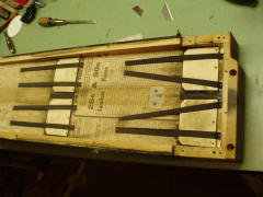 Inside of pressure pump, showing original flap valves, straps and newspaper seals.