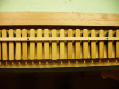 Pipe chest pneumatics after recovering with new pneumatic cloth.
