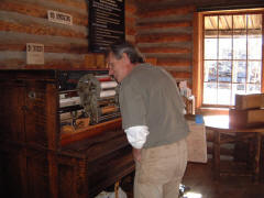 Staff member Klaus Mackensen (Maintenance) examines the newly-restored DX.