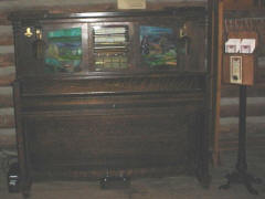 The completed Wurlitzer DX with its leaded glass front installed, ready to perform for the 80,000 people who visit Virginia City and Nevada City each year. The AMICA membership brochures to the right will help to raise public awareness of our group and automatic musical instrument collecting.