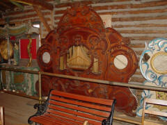 54-keyless Unpainted Organ. Originally a barrel organ, with faade possibly made by Bruder. N.C. Music Hall; from B.A.B. hoard.