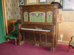 Cremona style G coin piano #10,836 with flute pipes, made in 1914; V.C. Opera House lobby.