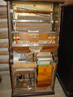 Peerless 44 coin piano #6,294 with front removed, circa 1915; N.C. Music Hall.
